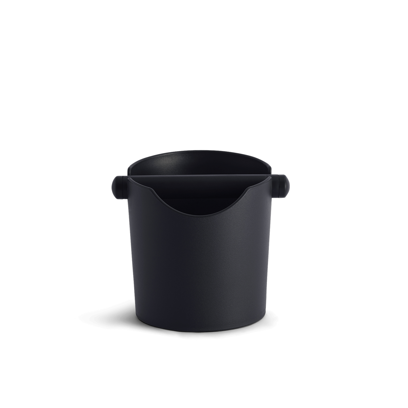 A black counter knock tube designed for espresso brewing, featuring a cushioned surface with a removable rubber bar and a rubber base.
