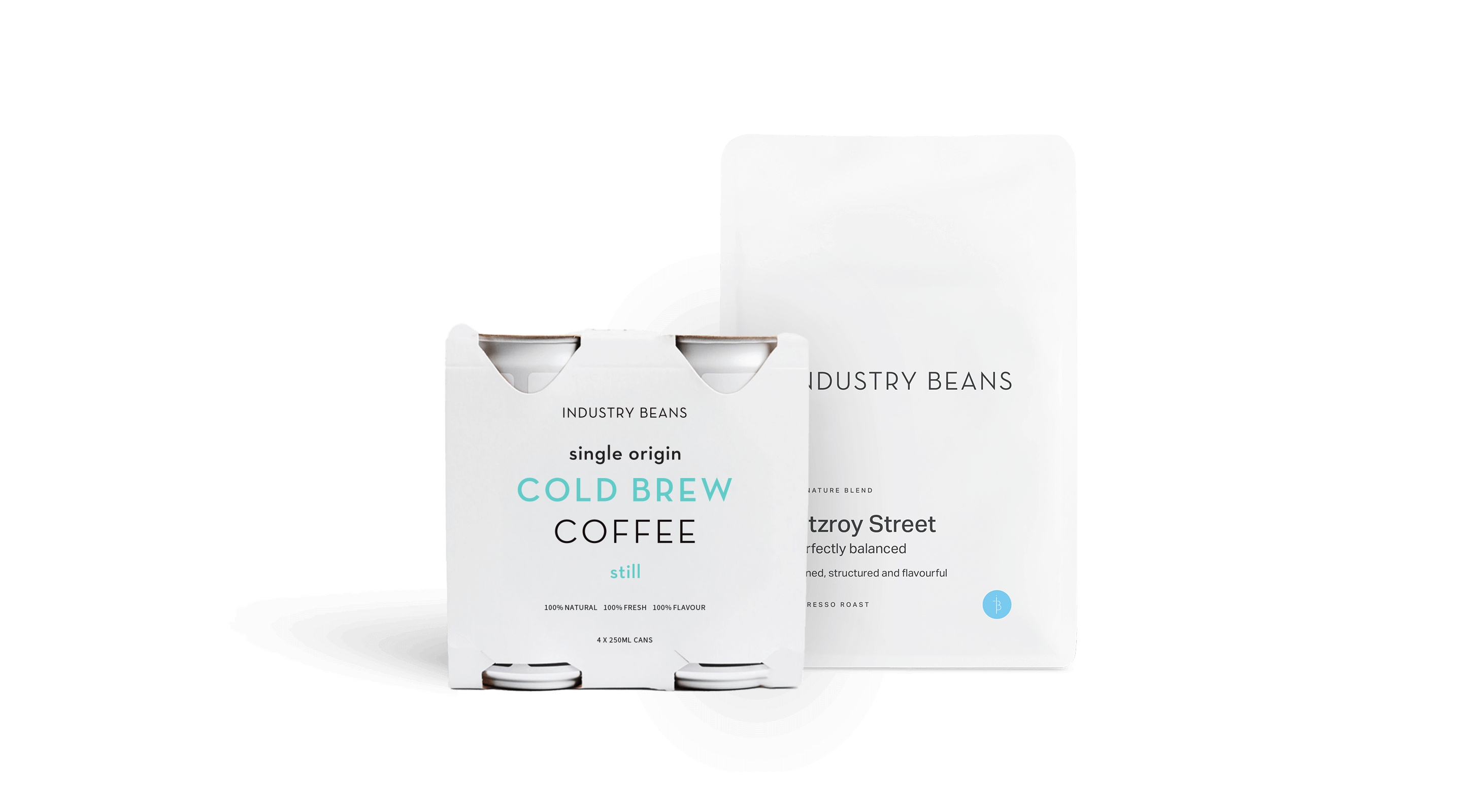 Two packages of Industry Beans coffee on a black background