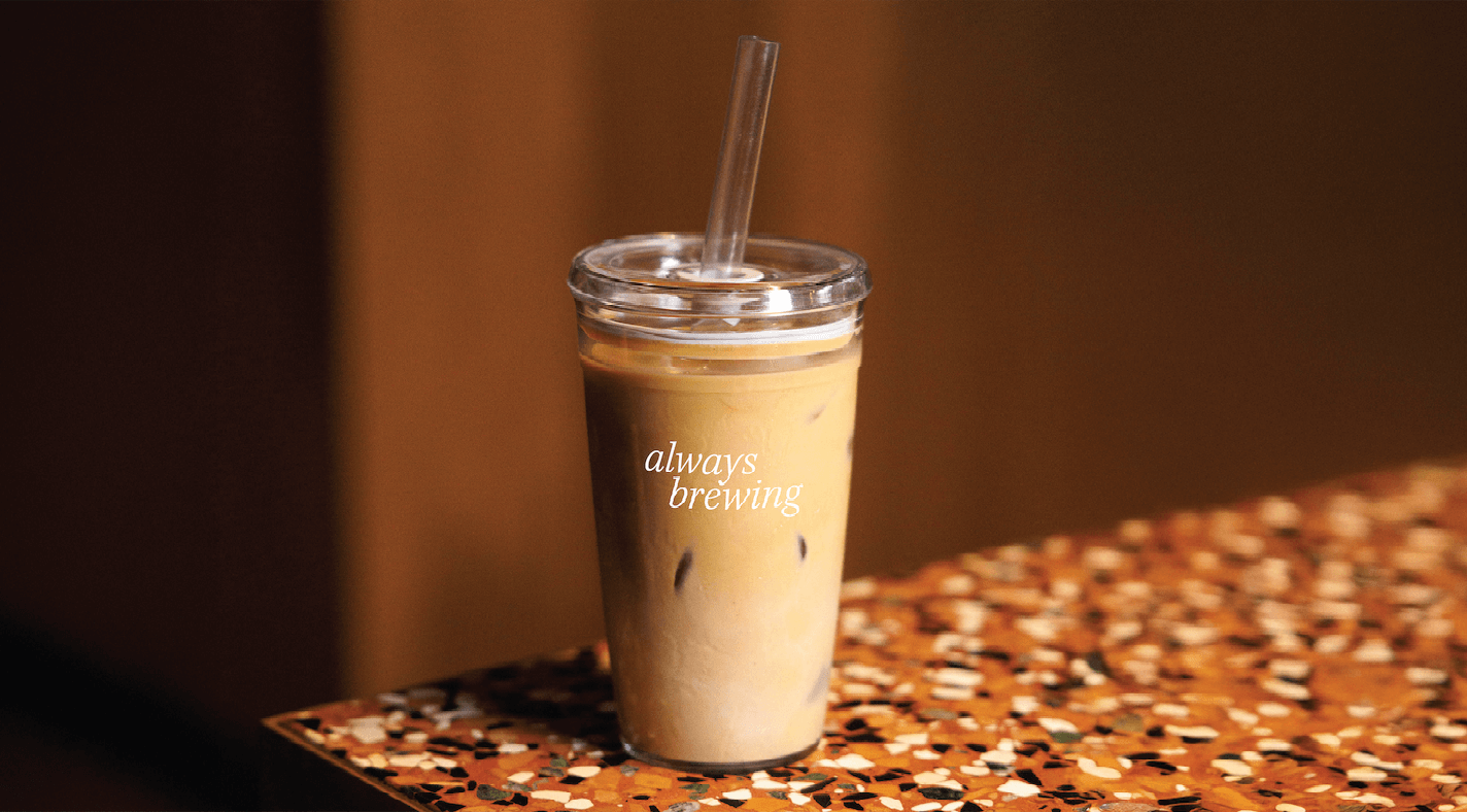 clear coffee tumbler on bench