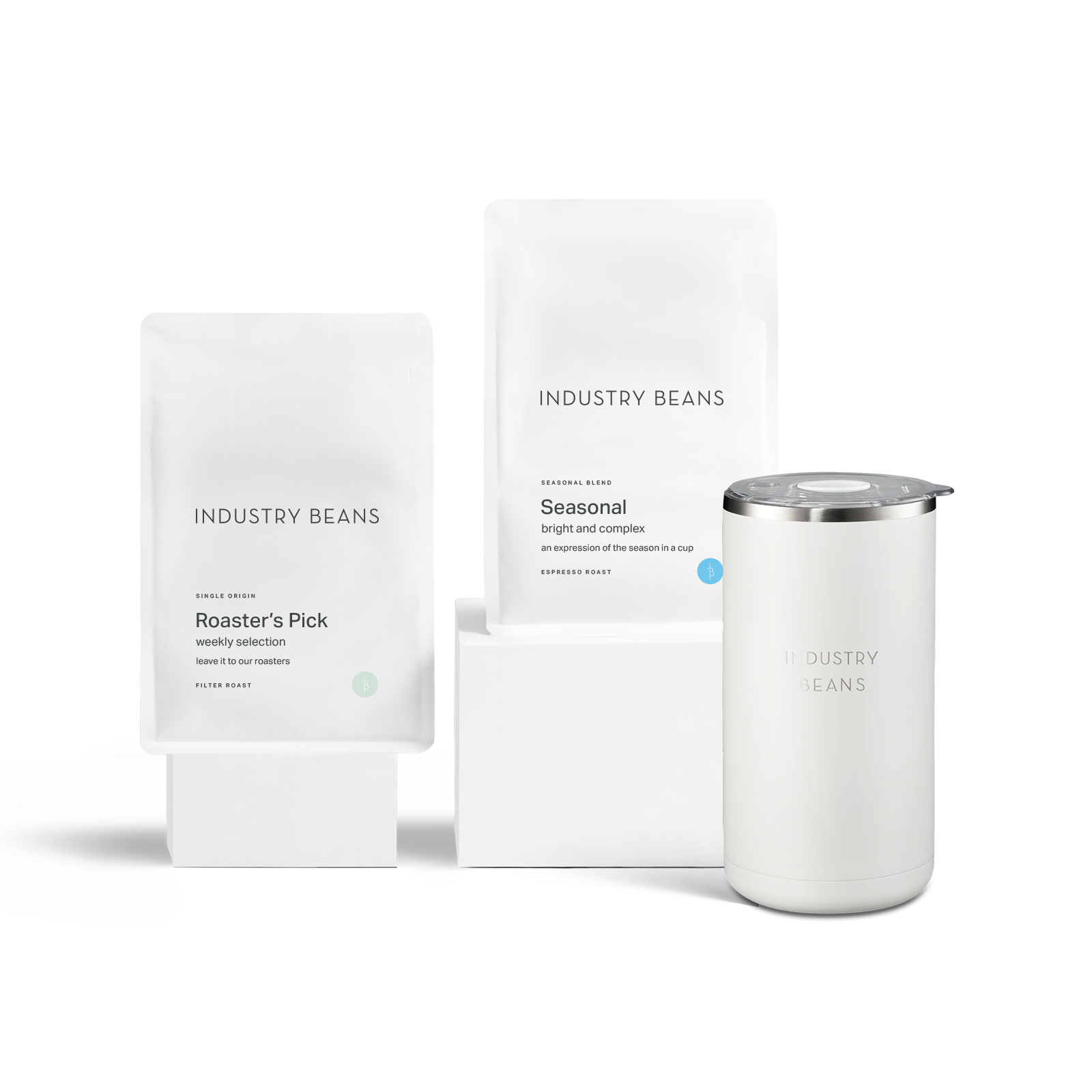 A French press starter kit including a white coffee maker, a white storage bag, and a brewing guide.