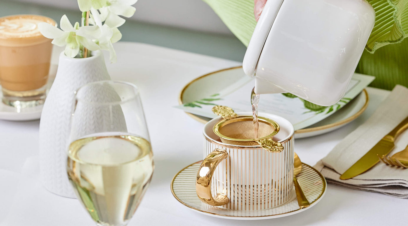 Pouring Tea out of a Tea Pot at High Tea