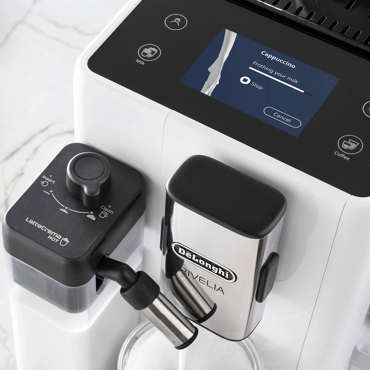 Delonghi coffee machine with a water filter on a white surface
