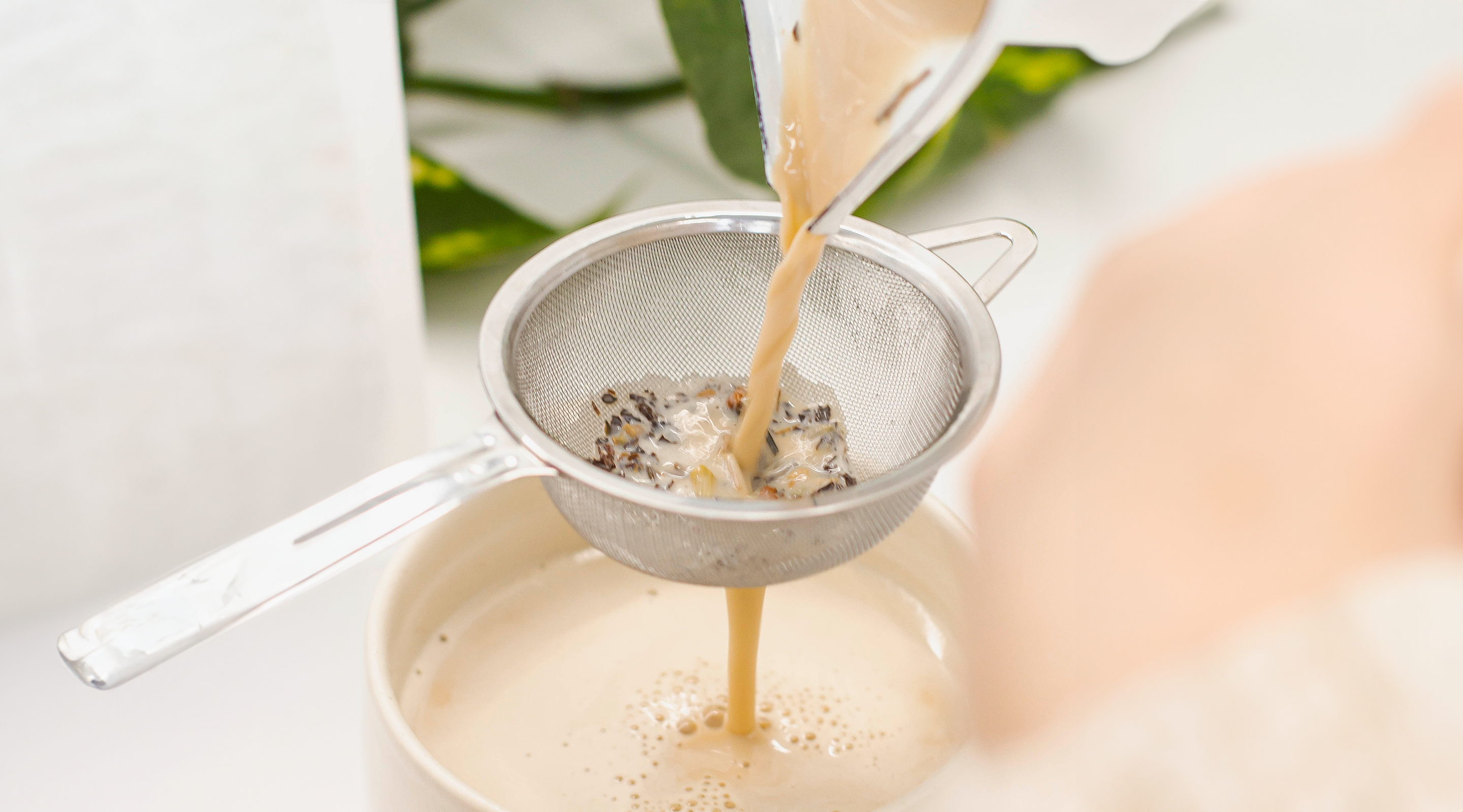 chai tea pouring into strainer