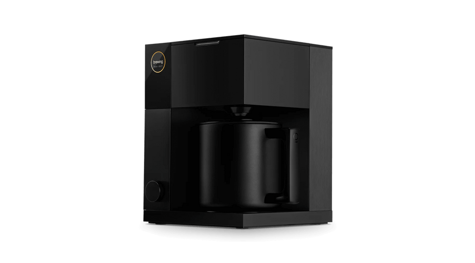 Black coffee maker on a black background