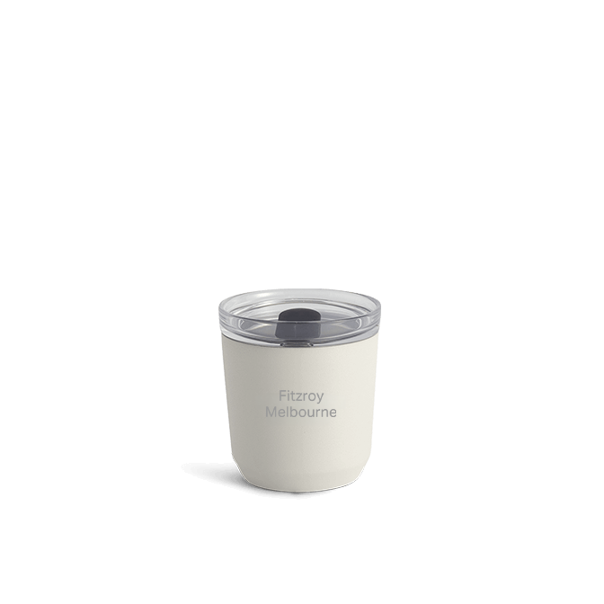 a white coffee cup with clear plastic lid